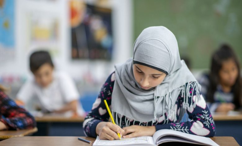 Female student wearing headscarf at a European school. iStock.