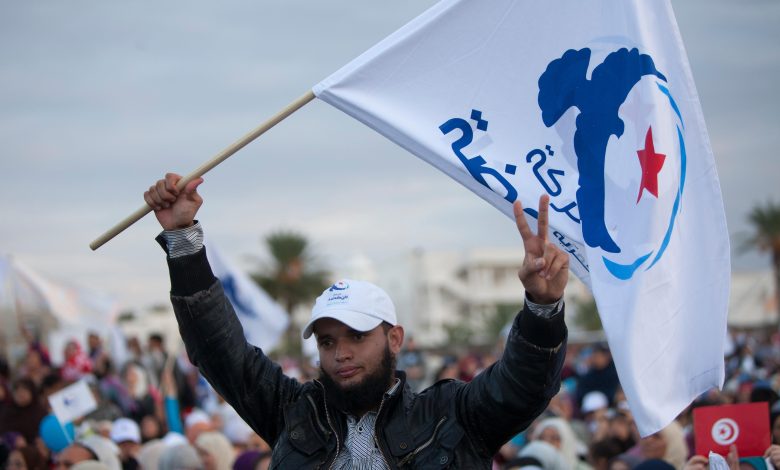 Activist with a flag of islamist party Ennahda during a rally before elections of the Constituent Assembly. 21 October 2011. Godong /Alamyvia .via Reuters