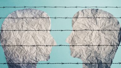 An illustrtion of two faces looking at each other behind a barbed fence, 14 October 2021.Berit Kessler/ Alamy via Rueters.