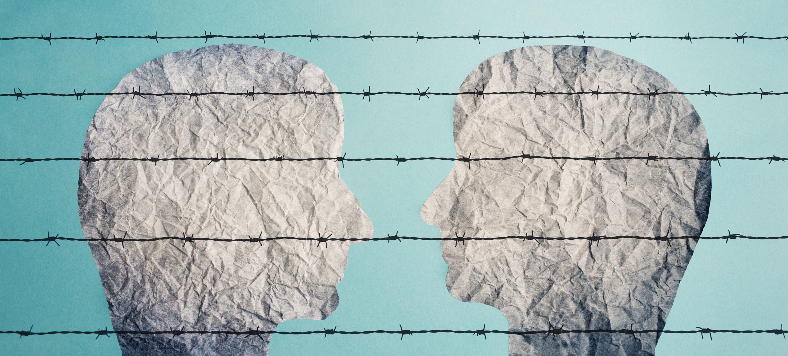 An illustrtion of two faces looking at each other behind a barbed fence, 14 October 2021.Berit Kessler/ Alamy via Rueters.