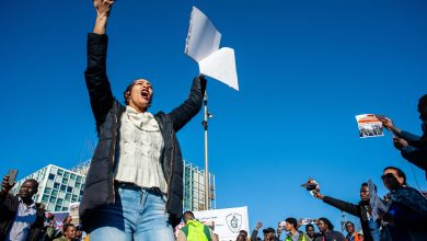 Protestors chanting during a demonstration outside the International Criminal Court in the Hague in solidarity with the revolution in Sudan, 15 February 2019. Source: ZUMA Press/ Alamy via Reuters.